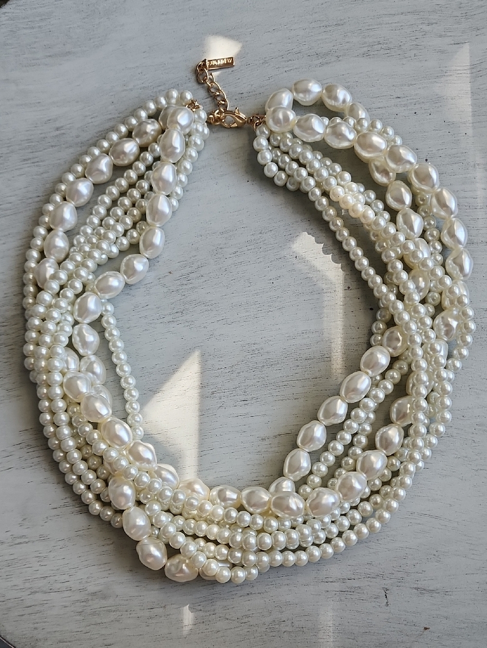 Ivory Multi-Strand Pearl Necklace with Gold Chain Accent